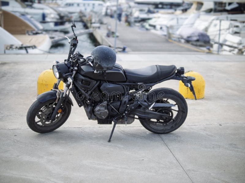 Classic motorcycle by the sea royalty free stock photography