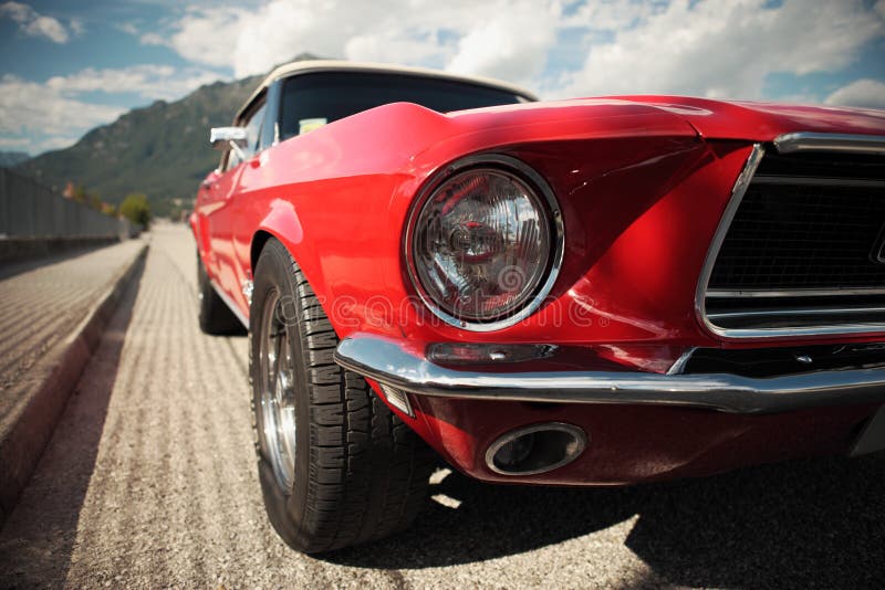 American muscle car convertible on the road, cropped image. American muscle car convertible on the road, cropped image