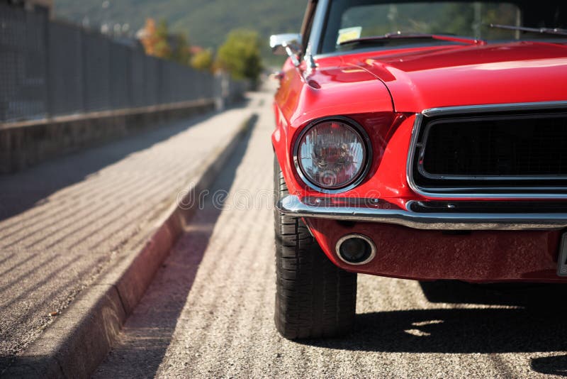 American muscle car convertible on the road, cropped image. American muscle car convertible on the road, cropped image