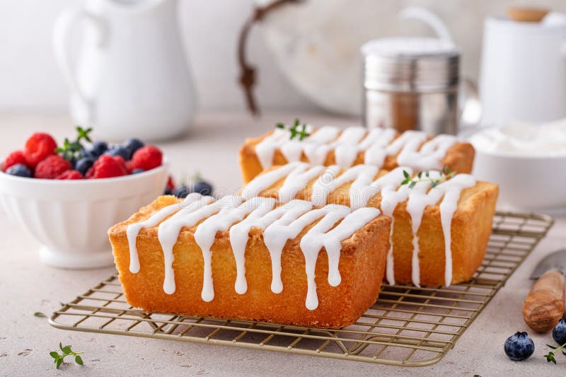 Classic Pound Cake with Powdered Sugar Glaze Dripping Over Stock Image