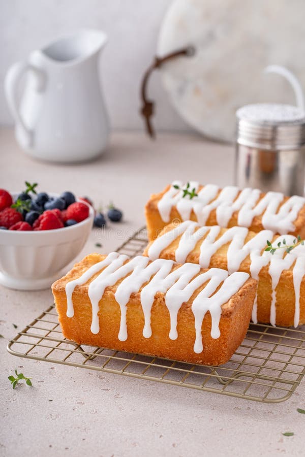 Classic Pound Cake with Powdered Sugar Glaze Dripping Over Stock Image