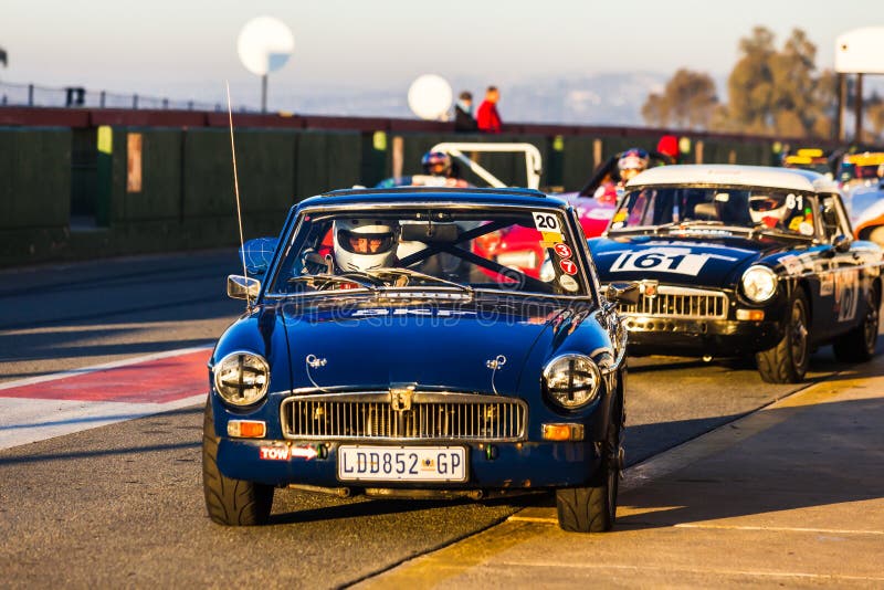 A historic car race held at the Kyalami racetrack in July 2014. A classic racing car lines up on the starting line at Kyalami race track on a cold winter morning.