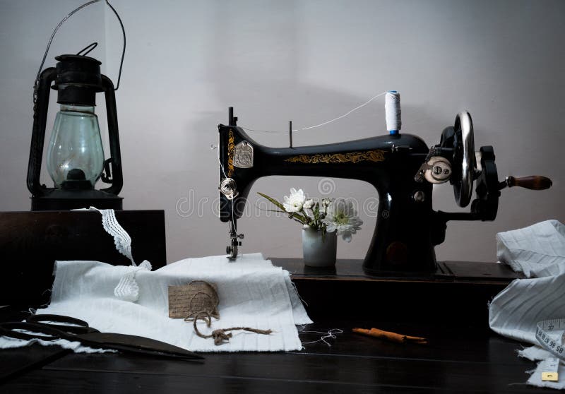 Classic Retro Style Manual Sewing Machine Ready for Work, Kerosene Lamp
