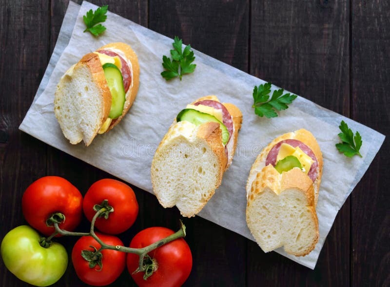 Classic Sandwich with Sausage and Cheese on White Baguette. Breakfast