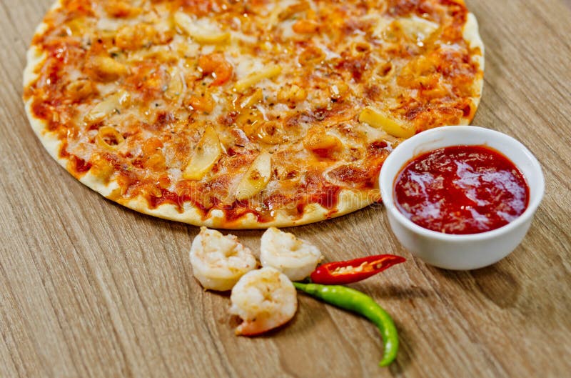 Classic Seafood Pizza with spicy chilli sauce. Classic Seafood Pizza with spicy chili sauce, Classic Seafood Pizza with white background at Bangladesh royalty free stock photos Classic Seafood Pizza with spicy chilli sauce. Classic Seafood Pizza with spicy chili sauce, Classic Seafood Pizza with white background at Bangladesh royalty free stock photos