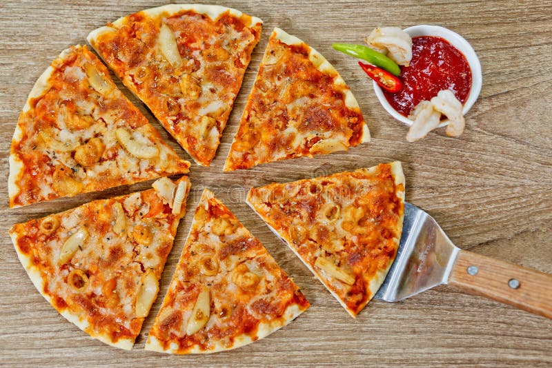 Classic Seafood Pizza with spicy chilli sauce. Classic Seafood Pizza with spicy chili sauce, Classic Seafood Pizza with white background at Bangladesh stock image Classic Seafood Pizza with spicy chilli sauce. Classic Seafood Pizza with spicy chili sauce, Classic Seafood Pizza with white background at Bangladesh stock image