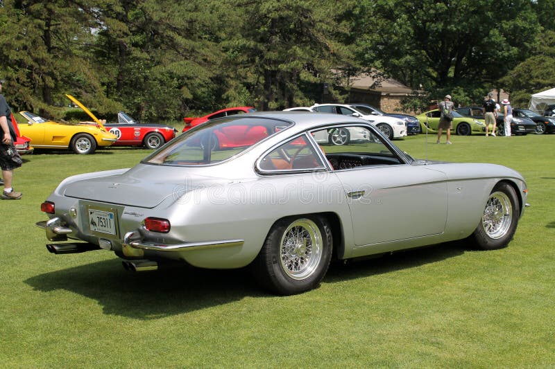 Classic silver Lamborghini 350 GT coupe sports car on display outdoors. 2013 Belle Macchine d'Italia car event, Pennsylvania. the 350 GT was the first ever lamborghini model. Classic silver Lamborghini 350 GT coupe sports car on display outdoors. 2013 Belle Macchine d'Italia car event, Pennsylvania. the 350 GT was the first ever lamborghini model.