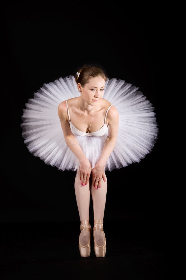 Classical ballerina in a white skirt