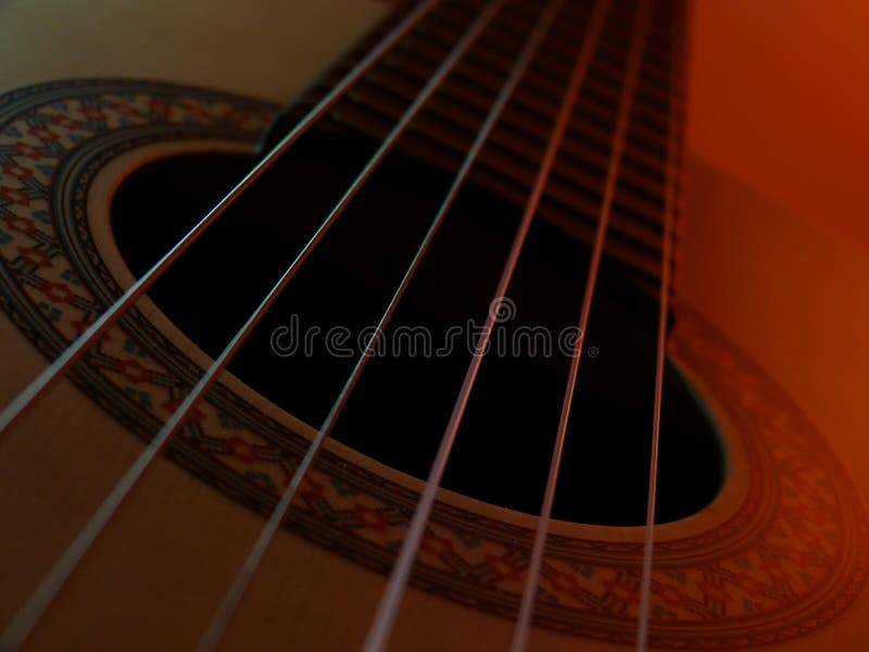 Classical guitar with golor light stock images