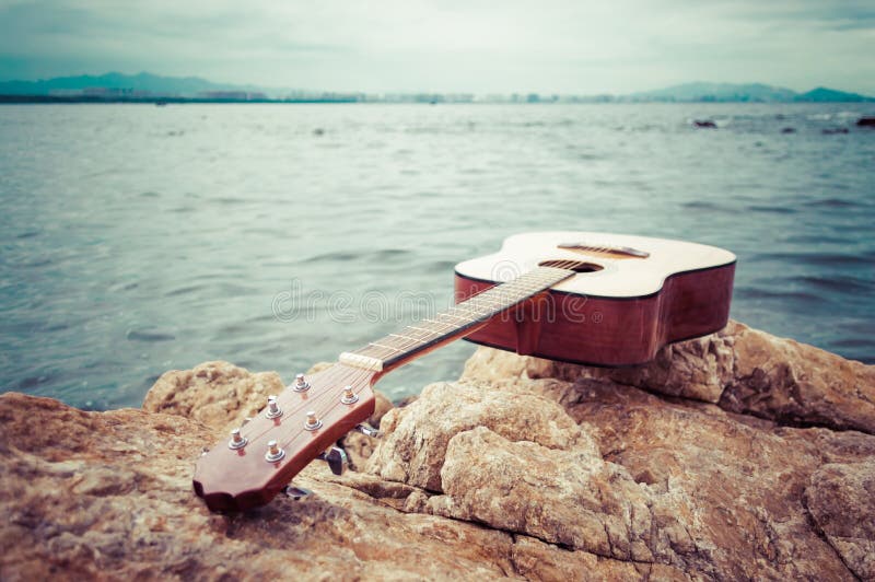 Classical Guitar on Seaside Rock Stock Photo Image of rock, seaside