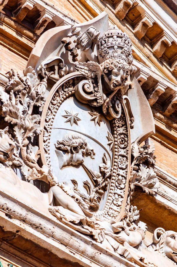 Classical marble emblem hanging on one of the facades of Vatican museums complex buildings in Pine Tree garden royalty free stock photos Classical marble emblem hanging on one of the facades of Vatican museums complex buildings in Pine Tree garden royalty free stock photos