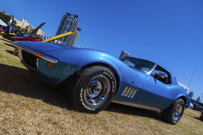 Gold Coast, Queensland- SEPTEMBER 16: Spectators viewing corvettes at the 18th Annual Corvettes, Wheels and Classic event at Gold Coast QLD Australia on September 16, 2013. Gold Coast, Queensland- SEPTEMBER 16: Spectators viewing corvettes at the 18th Annual Corvettes, Wheels and Classic event at Gold Coast QLD Australia on September 16, 2013