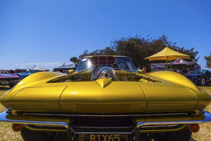 Gold Coast, Queensland- SEPTEMBER 16: Spectators viewing corvettes at the 18th Annual Corvettes, Wheels and Classic event at Gold Coast QLD Australia on September 16, 2013. Gold Coast, Queensland- SEPTEMBER 16: Spectators viewing corvettes at the 18th Annual Corvettes, Wheels and Classic event at Gold Coast QLD Australia on September 16, 2013