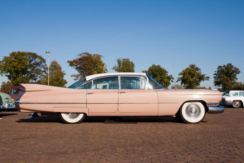 ROSMALEN, THE NETHERLANDS - OCTOBER 15: A 1959 Cadillac Sedan De Ville is shown at the Rock Around the Jukebox event on October 15, 2011 in Autotron Rosmalen, Holland. ROSMALEN, THE NETHERLANDS - OCTOBER 15: A 1959 Cadillac Sedan De Ville is shown at the Rock Around the Jukebox event on October 15, 2011 in Autotron Rosmalen, Holland