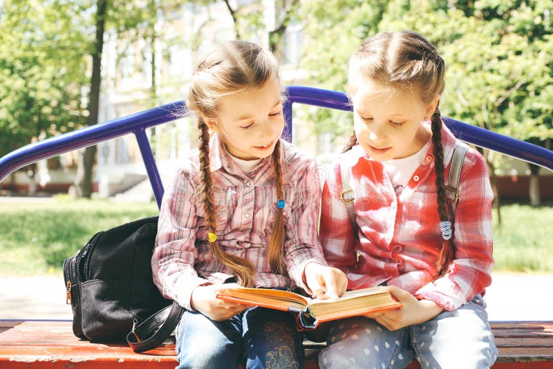 Classmates Sit and Read a Book Stock Image Image of model, human