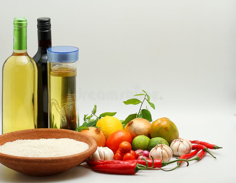 Rice, cooking oil and vegetables, isolated on white background stock photo