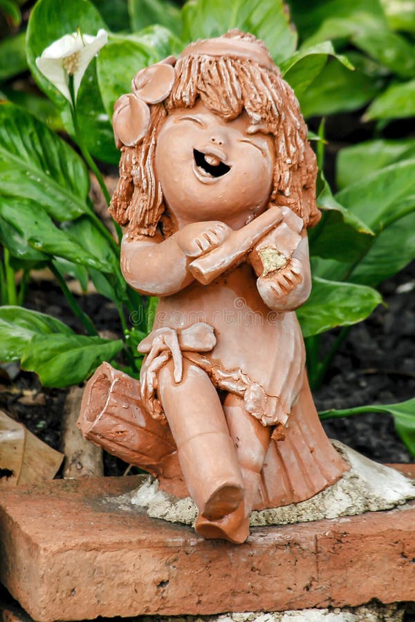 Clay dolls used for garden decoration.