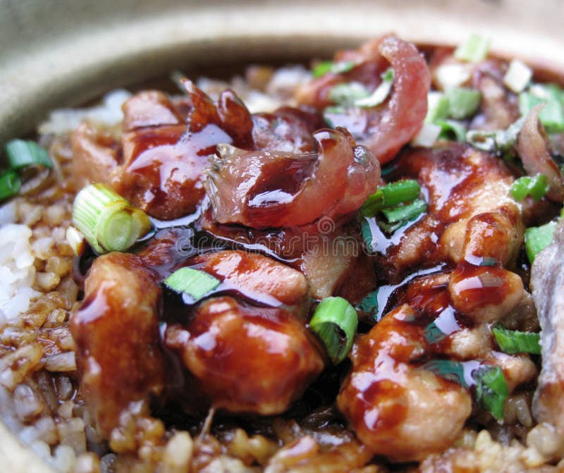 A bowl of clay pot chicken rice, asian style food. A bowl of clay pot chicken rice, asian style food