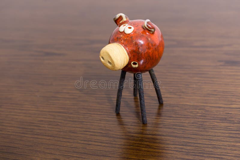 Clay pig decoration on a table.