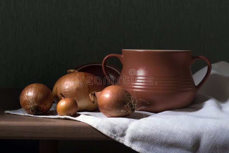 Clay pot and onions