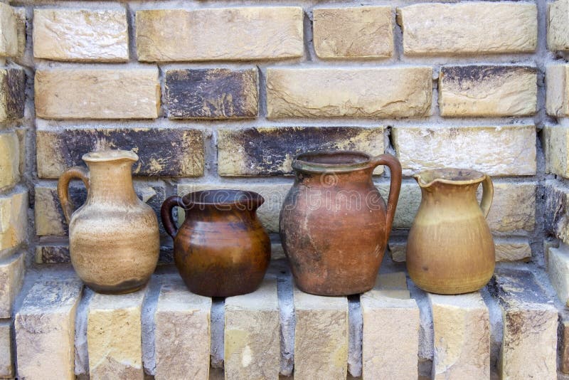 Clay pots on a brick wall