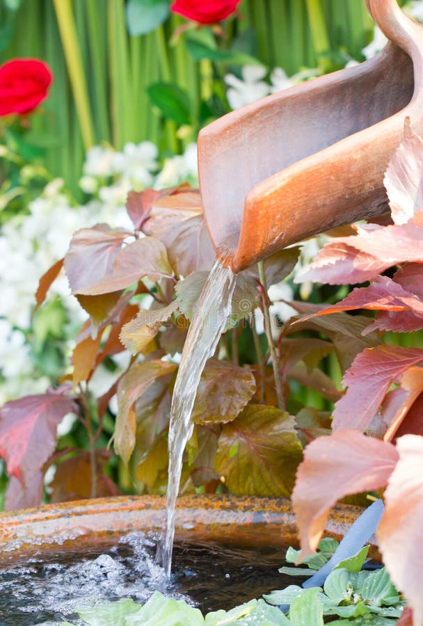 Close Up Of Clay Water Feature With Pond.