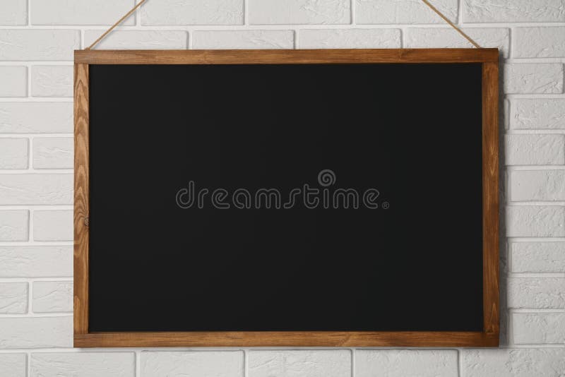 Clean Black Chalkboard Hanging on White Brick Wall Stock Photo Image