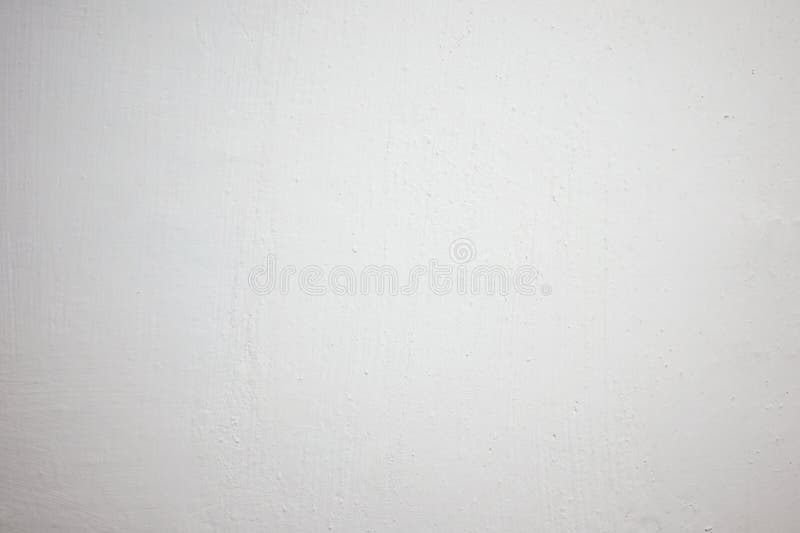 Blank white wall in a simple interior space with natural lighting royalty free stock photo