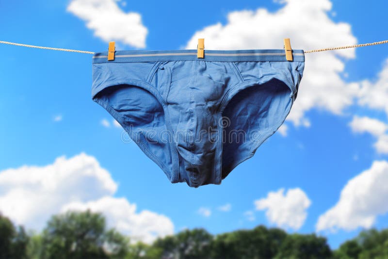 Clean Blue Men S Briefs Hanging on Rope To Dry Outdoors on Sunny