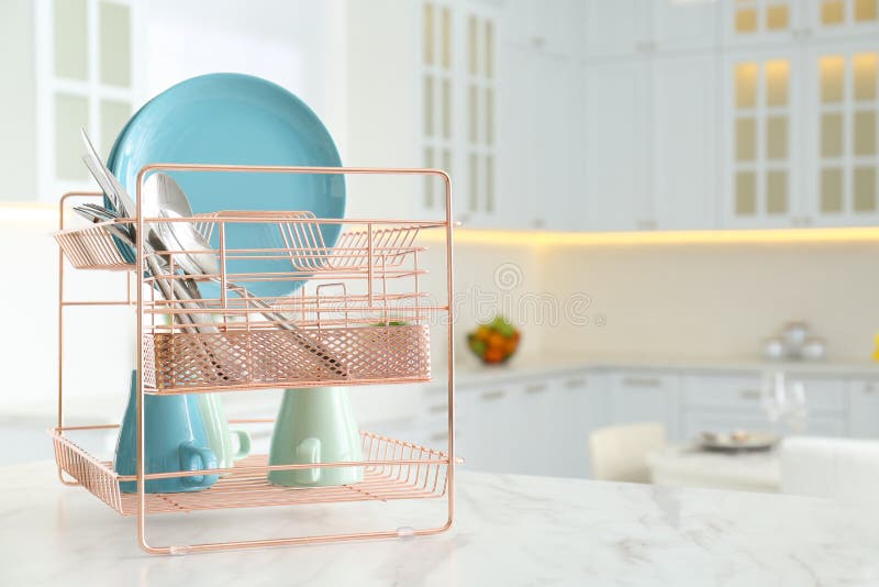 Clean Dishes on Drying Rack in Modern Kitchen Interior, Space for Text