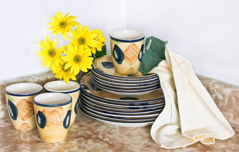 Clean dishes and yellow flowers