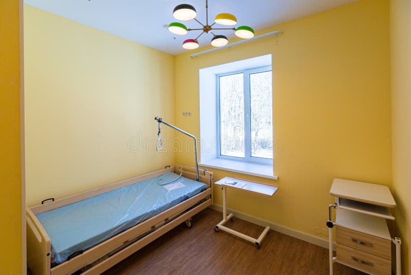 Clean Empty Hospital or Hospice Room with New Bed that is Ready for One