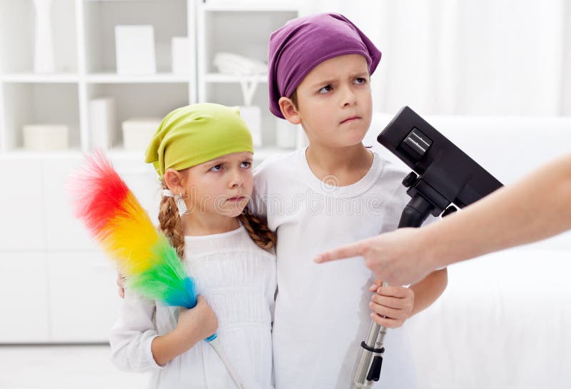 Kids forced to clean their room, parent hand pointing. Kids forced to clean their room, parent hand pointing