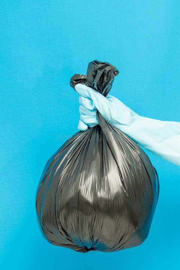 Cleaner Concept, Hand in Rubber Gloves and Holding Plastic Bag with ...