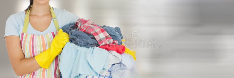 Cleaner holding laundry basket with bright background