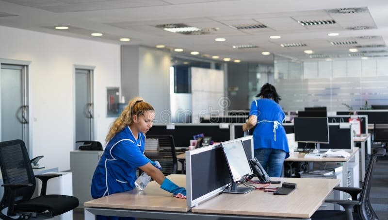 Cleaners clean empty office spaces