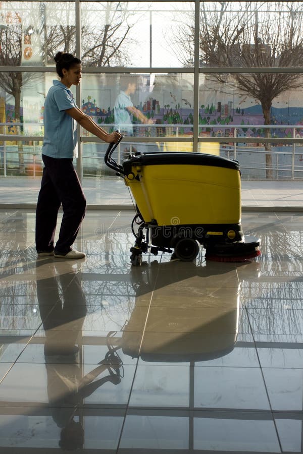 Man Driving Professional Floor Cleaning Machine at Airport or Railway