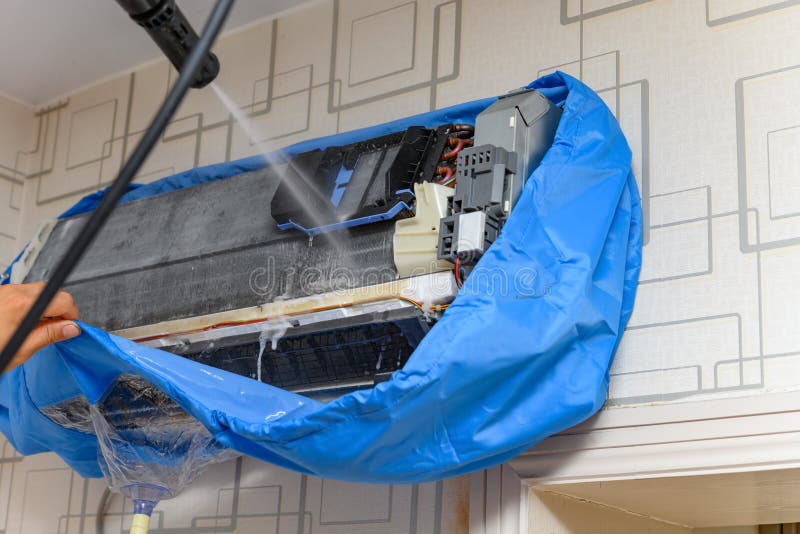 Cleaning the Air Conditioner with Some Chemical Liquid Stock Image