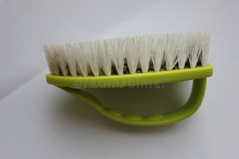 Cleaning brush with plastic base and handle royalty free stock images