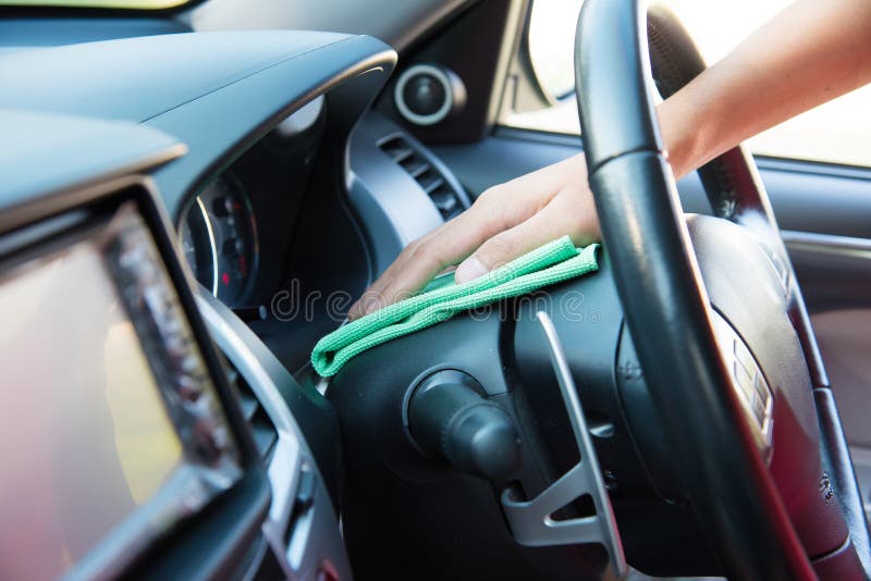 Cleaning the Car Interior with Green Microfiber Cloth Stock Image