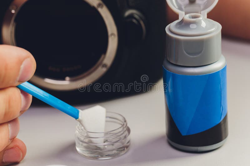 Cleaning Dirty Camera Sensor. Digital Photo Camera with Cleaning Tools