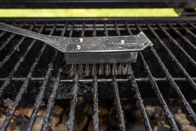 Cleaning a Dirty Grill while Standing on the Terrace and Emptying the