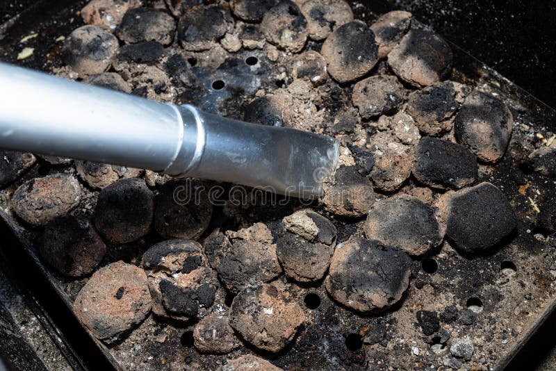 Cleaning a Dirty Grill while Standing on the Terrace and Emptying the