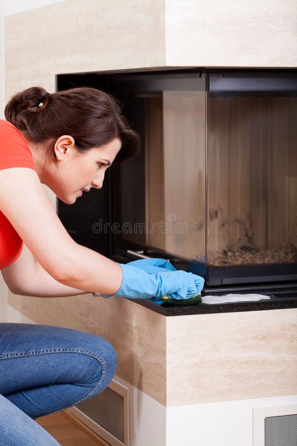 Cleaning the fireplace stock photo. Image of female, chores 41854528