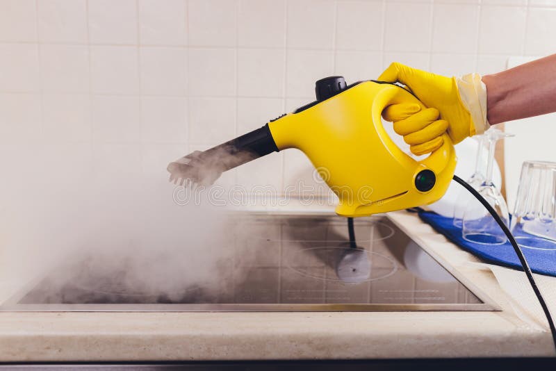 Cleaning Kitchen Hob with a Steam Cleaner. Stock Image Image of home
