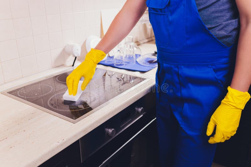 Cleaning Kitchen Hob with a Steam Cleaner. Stock Photo Image of