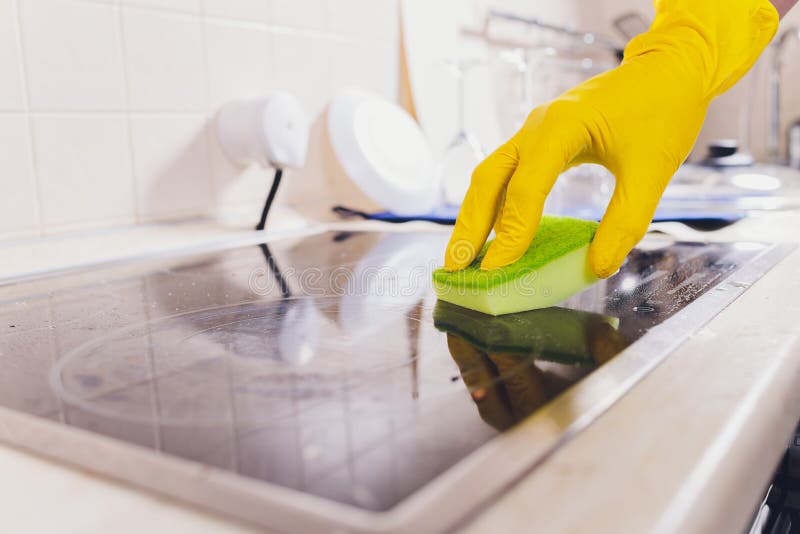 Cleaning Kitchen Hob with a Steam Cleaner. Stock Photo Image of