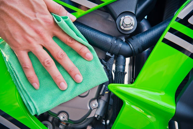 Cleaning motorcycle stock photo. Image of wash, white 101775836