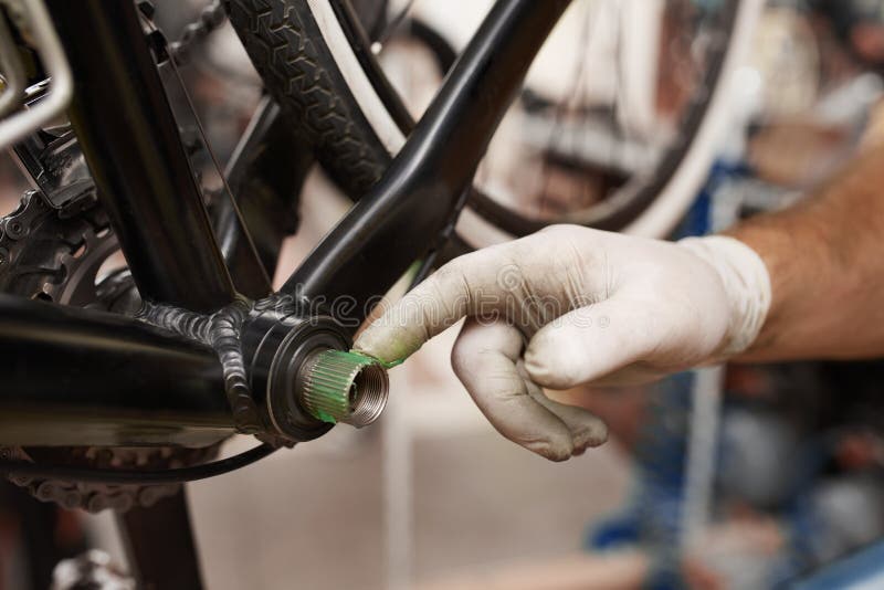 Cleaning and Oiling a Bicycle Chain and Gear with Oil Stock Image