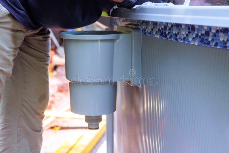 Cleaning of pool surface from dirt, trash debris with pool skimmer basket installed on a frame that collects dirt trash royalty free stock photos